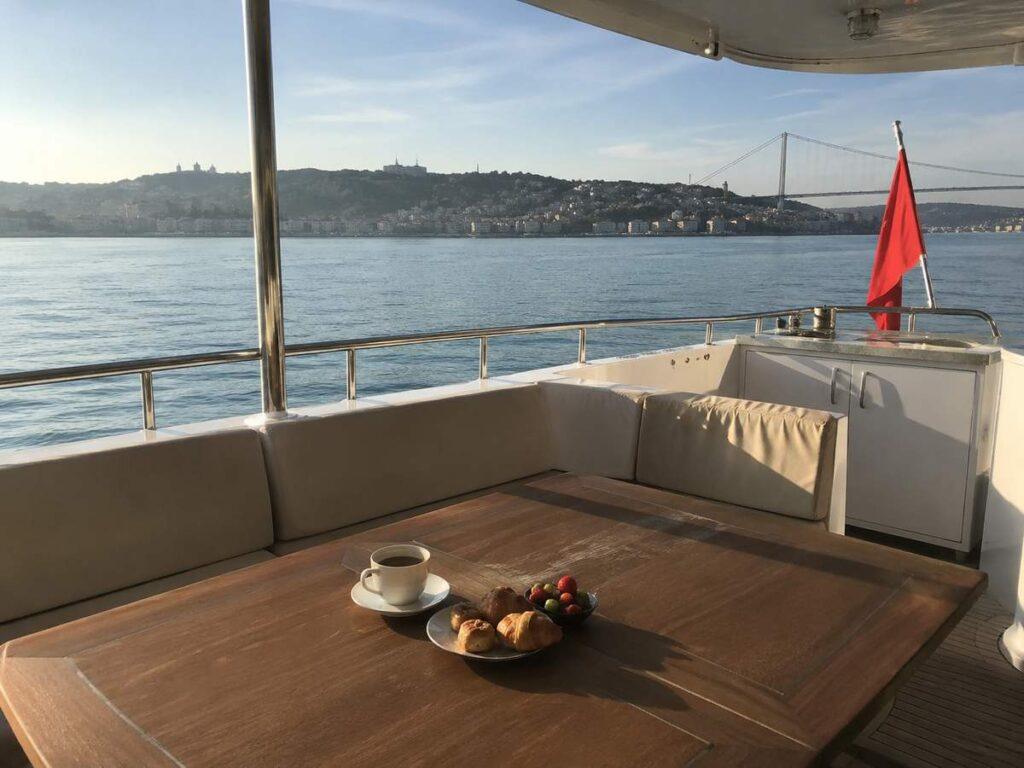 bosphorus-morning-cruise Breakfast table with coffee and pastries on a morning Bosphorus cruise