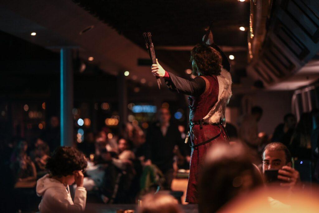 Travellers enjoying live entertainment on an Istanbul dinner cruise on the Bosphorus